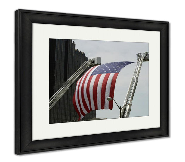 Framed Print, An Large American Flag Hanging Between Firefighter Truck Ladders - ultrawallart.com