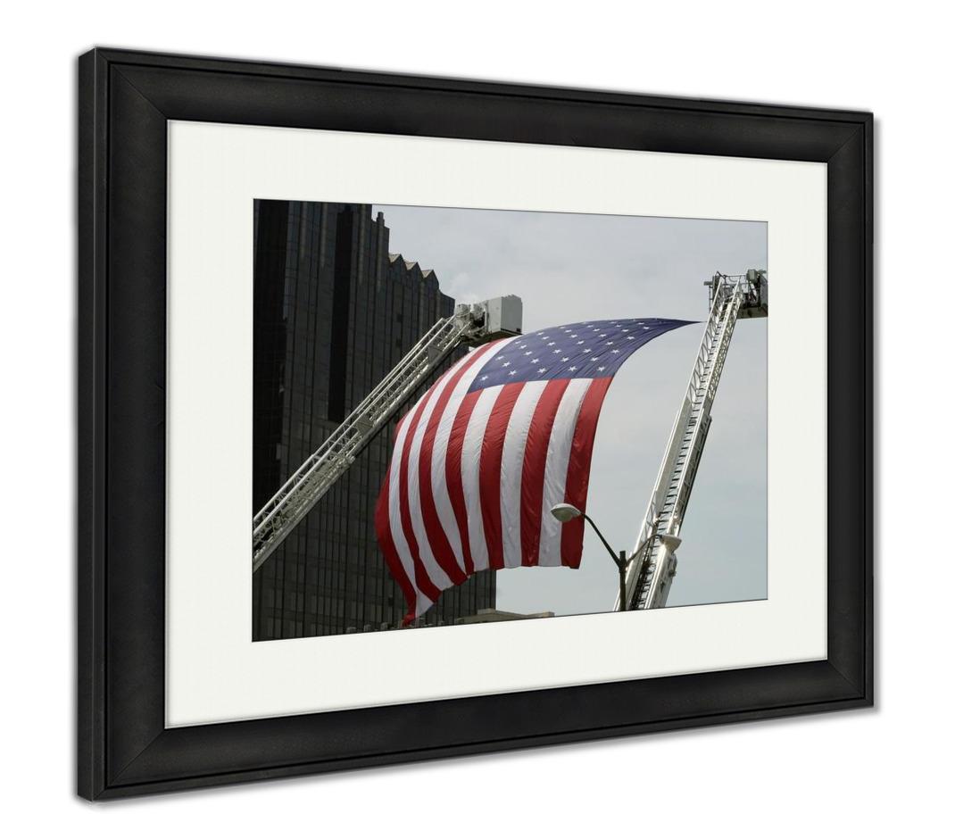 Framed Print, An Large American Flag Hanging Between Firefighter Truck Ladders - ultrawallart.com